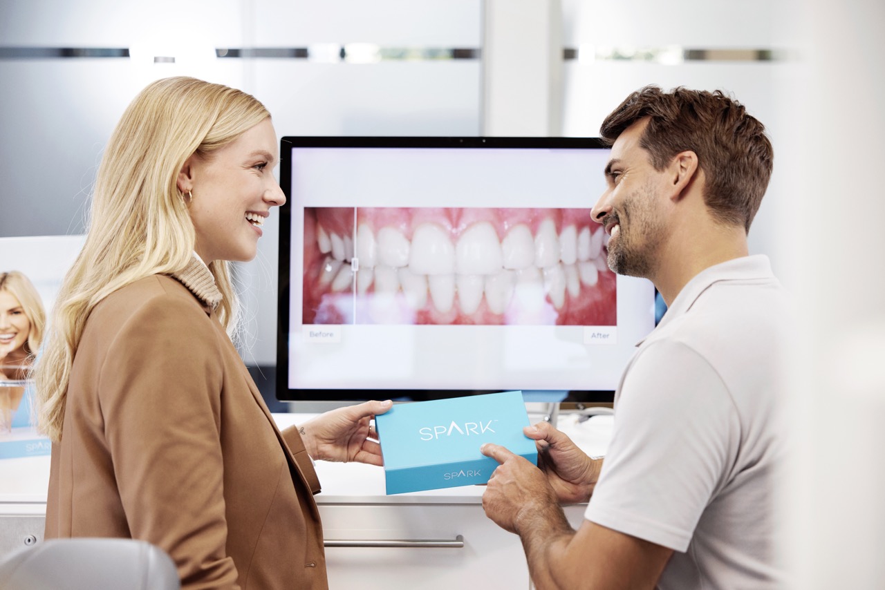 Spark™ aligner being placed during a clinical appointment — Spark brand photography